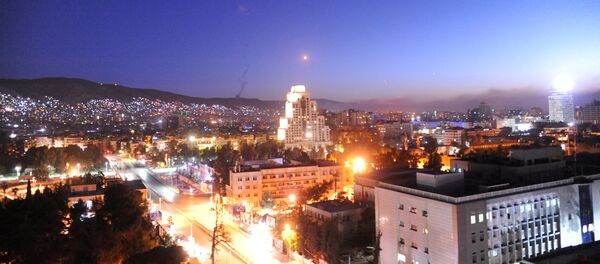 A missile is seen crossing over Damascus, Syria April 14, 2018 A missile is seen crossing over Damascus, Syria April 14, 2018 - Sputnik International