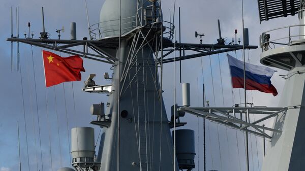 State flags of Russia and China are flown on destroyer Shijiazhuang during the Russian-Chinese exercise Naval Interaction 2017 - Sputnik International