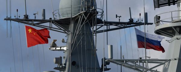State flags of Russia and China are flown on destroyer Shijiazhuang during the Russian-Chinese exercise Naval Interaction 2017 - Sputnik International