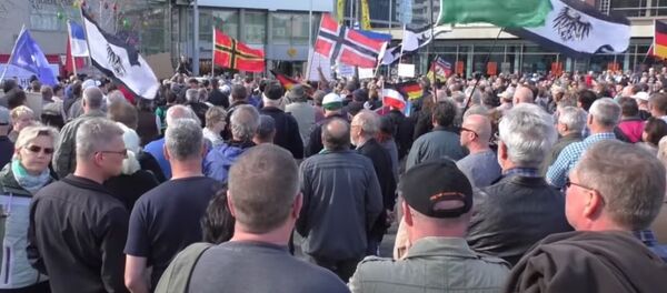 Germany: Anti-migrant rally in Cottbus demands closed borders Germany: Anti-migrant rally in Cottbus demands closed borders - Sputnik International