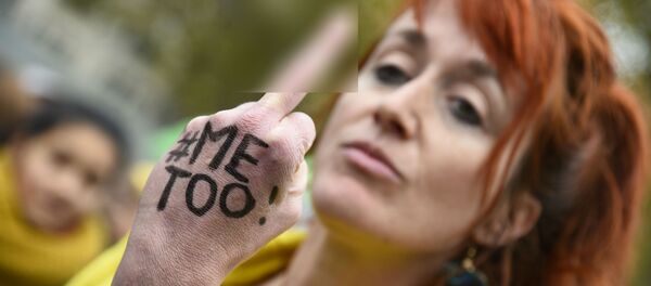 A woman with the message Me too on her hand gives the middle finger during a gathering against gender-based and sexual violence called by the Effronté-e-s Collective, on the Place de la Republique square in Paris on October 29, 2017 A woman with the message Me too on her hand gives the middle finger during a gathering against gender-based and sexual violence called by the Effronté-e-s Collective, on the Place de la Republique square in Paris on October 29, 2017 - Sputnik International