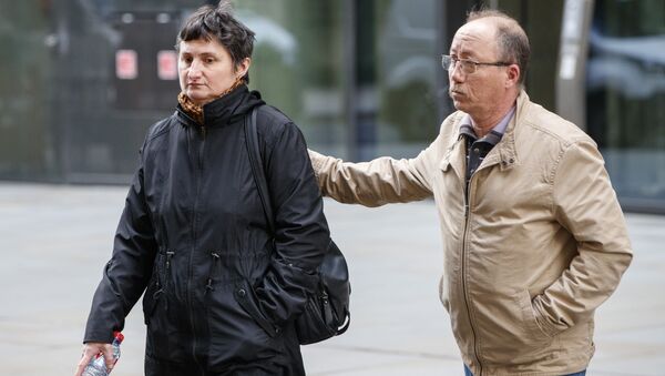 Sophie Lionnet's mother Catherine and her grandfather Stephane Devallone outside the court on Monday April 16 - Sputnik International