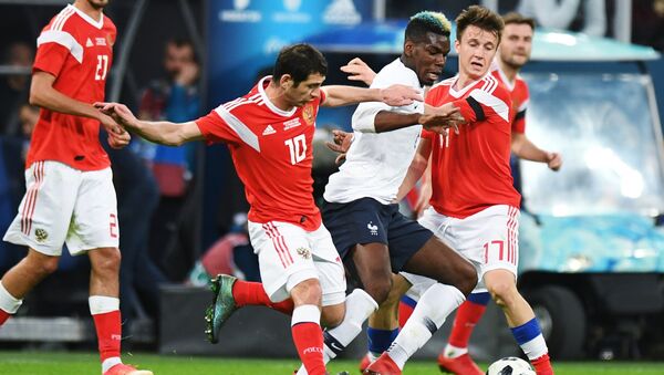 From left, first plan: Alan Dzagoyev (Russia), Paul Pogba (France) and Alexander Golovin (Russia) during the friendly match between Russia and France - Sputnik International