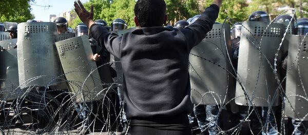 A demonstrator argues with riot police during a protest against Armenia's ruling Republican party's nomination of former President Serzh Sarksyan as its candidate for prime minister, in Yerevan, Armenia April 16, 2018. A demonstrator argues with riot police during a protest against Armenia's ruling Republican party's nomination of former President Serzh Sarksyan as its candidate for prime minister, in Yerevan, Armenia April 16, 2018. - Sputnik International