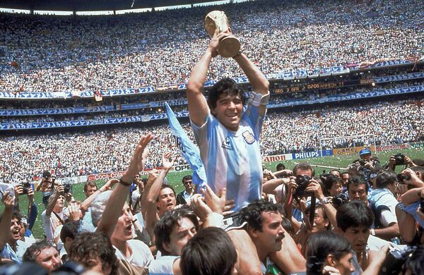 Diego Maradona of Argentina celebrates with the cup at the end of the World Cup soccer final in the Atzeca Stadium, in Mexico City, Mexico. (File) Diego Maradona of Argentina celebrates with the cup at the end of the World Cup soccer final in the Atzeca Stadium, in Mexico City, Mexico. (File) - Sputnik International
