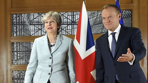 British Prime Minister Theresa May, left, walks with European Council President Donald Tusk prior to a meeting at the Europa building in Brussels on Friday, Dec. 8, 2017. - Sputnik International