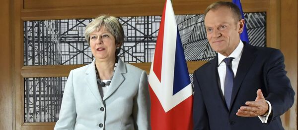 British Prime Minister Theresa May, left, walks with European Council President Donald Tusk prior to a meeting at the Europa building in Brussels on Friday, Dec. 8, 2017. - Sputnik International