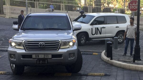 United Nations vehicles carry the team of the Organization for the Prohibition of Chemical Weapons (OPCW), arrive at hotel hours after the U.S., France and Britian launched an attack on Syrian facilities to punish President Bashar Assad for suspected chemical attack against civilians, in Damascus, Syria, Saturday, April 14, 2018 - Sputnik International