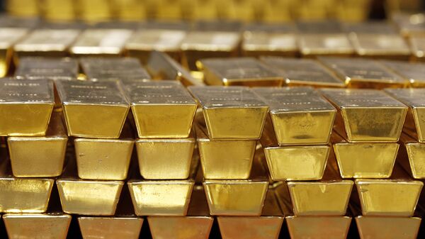 In this Tuesday, July 22, 2014, file photo, gold bars are stacked in a vault at the United States Mint, in West Point, N.Y. - Sputnik International