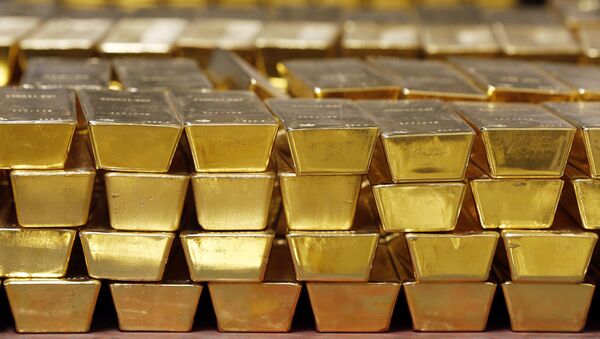 In this Tuesday, July 22, 2014, file photo, gold bars are stacked in a vault at the United States Mint, in West Point, N.Y. - Sputnik International