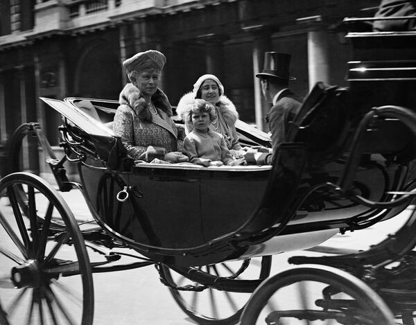 Britain's Queen Mary, left, with Princess Elizabeth accompanied by the lady Elizabeth Bowes Lyon, the Duchess of York, right, returning to Buckingham Palace, London, after the Trooping of the Colour Cermony on June 2, 1931 Britain's Queen Mary, left, with Princess Elizabeth accompanied by the lady Elizabeth Bowes Lyon, the Duchess of York, right, returning to Buckingham Palace, London, after the Trooping of the Colour Cermony on June 2, 1931 - Sputnik International