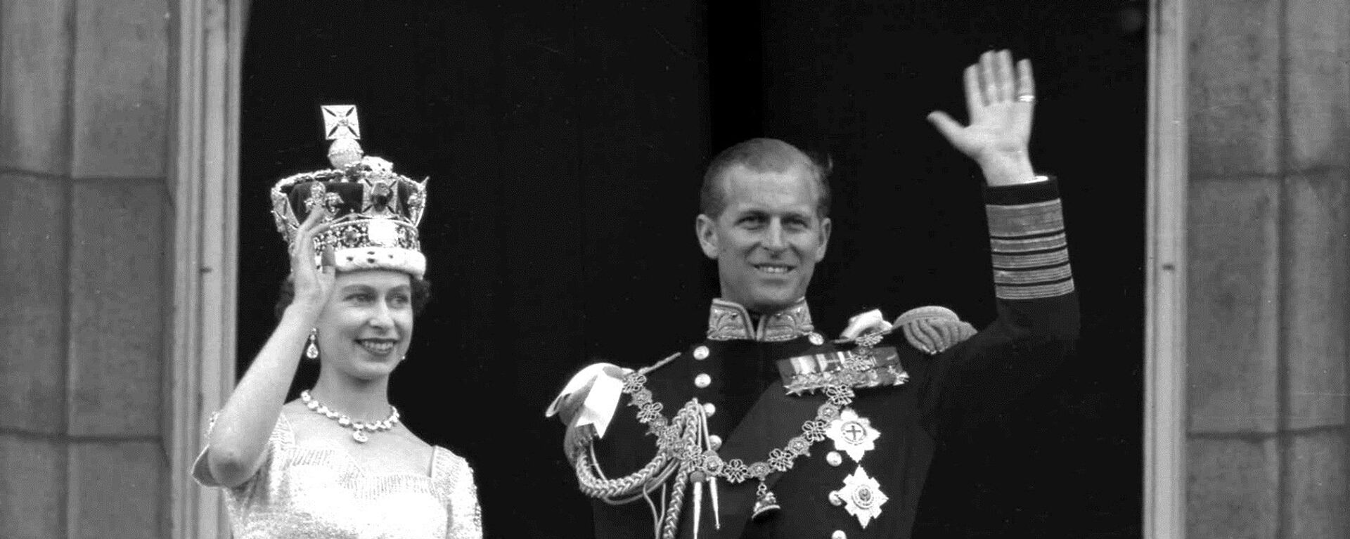 This is a June. 2, 1953 file photo of Britain's Queen Elizabeth II and Prince Philip, Duke of Edinburgh, as they wave to supporters from the balcony at Buckingham Palace, following her coronation at Westminster Abbey. London - Sputnik International, 1920, 10.02.2021