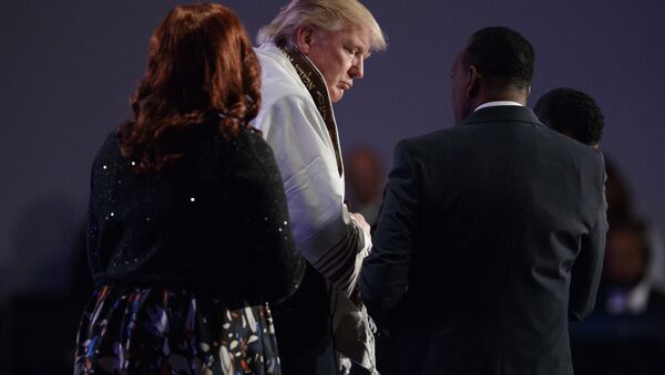 Donald Trump wears a prayer shawl during a church service - Sputnik International