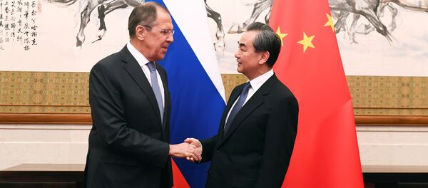 Russian Foreign Minister Sergei Lavrov shakes hands with Chinese State Councilor and Foreign Minister Wang Yi at the Diaoyutai State Guest House in Beijing, China, April 23, 2018 Russian Foreign Minister Sergei Lavrov shakes hands with Chinese State Councilor and Foreign Minister Wang Yi at the Diaoyutai State Guest House in Beijing, China, April 23, 2018 - Sputnik International