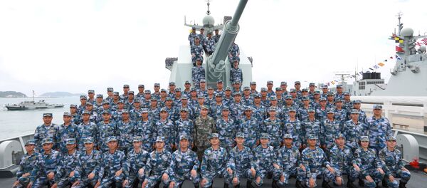 Chinese President Xi Jinping poses for a group photo on the destroyer Changsha as he reviews a military display of Chinese People's Liberation Army (PLA) Navy in the South China Sea April 12, 2018 Chinese President Xi Jinping poses for a group photo on the destroyer Changsha as he reviews a military display of Chinese People's Liberation Army (PLA) Navy in the South China Sea April 12, 2018 - Sputnik International