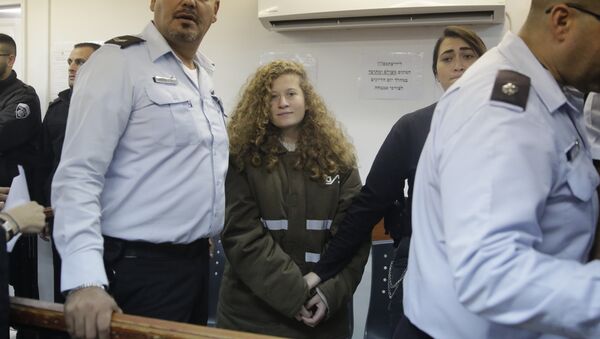 Ahed Tamimi is brought to a courtroom inside the Ofer military prison near Jerusalem, Monday, Jan. 15, 2018 - Sputnik International