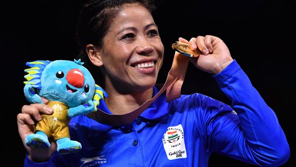 India's Mary Kom poses with her gold medal after beating Northern Ireland's Kristina O'Hara in their women's 45-48kg final boxing match during the 2018 Gold Coast Commonwealth Games at the Oxenford Studios venue on the Gold Coast on April 14, 2018 - Sputnik International