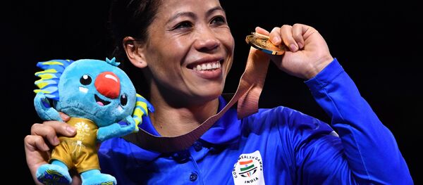 India's Mary Kom poses with her gold medal after beating Northern Ireland's Kristina O'Hara in their women's 45-48kg final boxing match during the 2018 Gold Coast Commonwealth Games at the Oxenford Studios venue on the Gold Coast on April 14, 2018 India's Mary Kom poses with her gold medal after beating Northern Ireland's Kristina O'Hara in their women's 45-48kg final boxing match during the 2018 Gold Coast Commonwealth Games at the Oxenford Studios venue on the Gold Coast on April 14, 2018 - Sputnik International