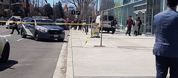 Police officers arrest suspect driver after a van hit multiple people at a major intersection in Toronto Police officers arrest suspect driver after a van hit multiple people at a major intersection in Toronto - Sputnik International