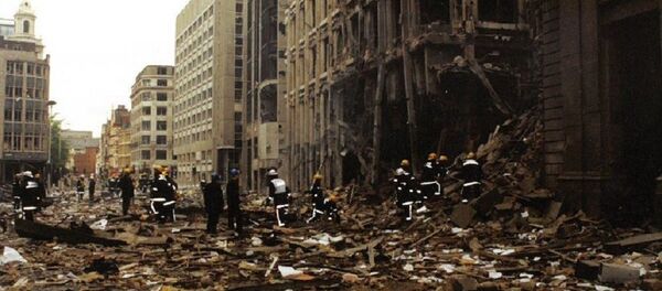 Firemen inspect the damage in Bishopsgate after the blast in April 1993 Firemen inspect the damage in Bishopsgate after the blast in April 1993 - Sputnik International