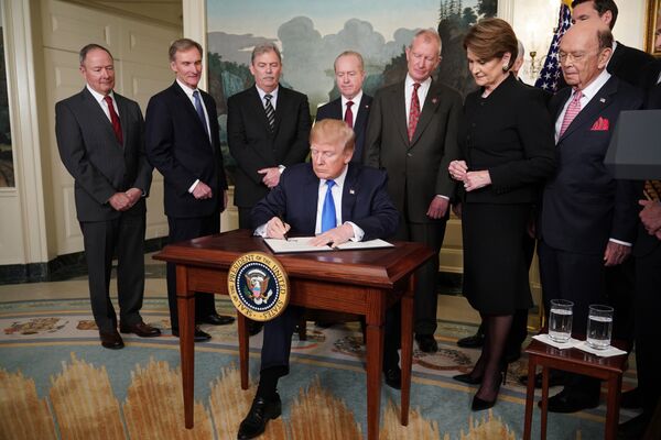 US President Donald Trump signs trade sanctions against China on March 22, 2018, in the Diplomatic Reception Room of the White House in Washington, DC, on March 22, 2018. Trump will impose tariffs on about $50 billion in Chinese goods imports to retaliate against the alleged theft of American intellectual property, White House officials said Thursday US President Donald Trump signs trade sanctions against China on March 22, 2018, in the Diplomatic Reception Room of the White House in Washington, DC, on March 22, 2018. Trump will impose tariffs on about $50 billion in Chinese goods imports to retaliate against the alleged theft of American intellectual property, White House officials said Thursday - Sputnik International