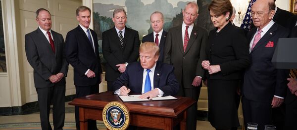 US President Donald Trump signs trade sanctions against China on March 22, 2018, in the Diplomatic Reception Room of the White House in Washington, DC, on March 22, 2018. Trump will impose tariffs on about $50 billion in Chinese goods imports to retaliate against the alleged theft of American intellectual property, White House officials said Thursday US President Donald Trump signs trade sanctions against China on March 22, 2018, in the Diplomatic Reception Room of the White House in Washington, DC, on March 22, 2018. Trump will impose tariffs on about $50 billion in Chinese goods imports to retaliate against the alleged theft of American intellectual property, White House officials said Thursday - Sputnik International