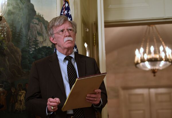 National security adviser John Bolton listens President Donald Trump speaks in the Diplomatic Reception Room of the White House on Friday, April 13, 2018, in Washington, about the United States' military response to Syria's chemical weapon attack on April 7 National security adviser John Bolton listens President Donald Trump speaks in the Diplomatic Reception Room of the White House on Friday, April 13, 2018, in Washington, about the United States' military response to Syria's chemical weapon attack on April 7 - Sputnik International