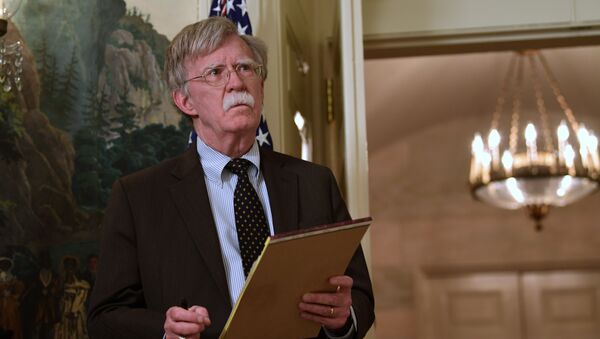 National security adviser John Bolton listens President Donald Trump speaks in the Diplomatic Reception Room of the White House on Friday, April 13, 2018, in Washington, about the United States' military response to Syria's chemical weapon attack on April 7 - Sputnik International