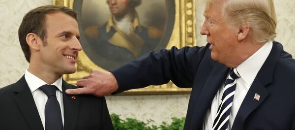French President Emmanuel Macron (L) looks on as U.S. President Donald Trump flicks a bit of lint off his jacket during their meeting in the Oval Office following the official arrival ceremony for Macron at the White House in Washington, U.S., April 24, 2018. French President Emmanuel Macron (L) looks on as U.S. President Donald Trump flicks a bit of lint off his jacket during their meeting in the Oval Office following the official arrival ceremony for Macron at the White House in Washington, U.S., April 24, 2018. - Sputnik International