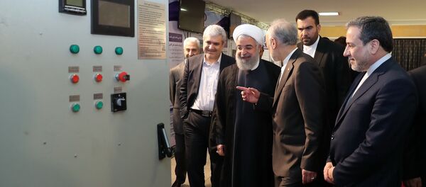  President Hassan Rouhani listens to explanations on new nuclear achievements at a ceremony to mark National Nuclear Day, in Tehran, Iran, Monday, April 9, 2018 - Sputnik International