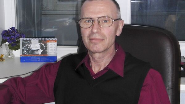 In this handout photo taken on May, 2011 by Russian chemical experts Vladimir Uglev poses for a photograph at an undisclosed location - Sputnik International