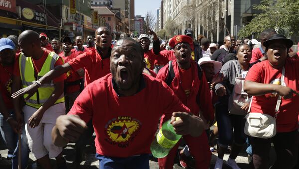 South Africa Federation Of Trade Unions (SAFTU) protesters gather in downtown Johannesburg, Wednesday, April 25, 2018, ahead of a march against the national minimum wage and the proposed changes in the labour laws - Sputnik International