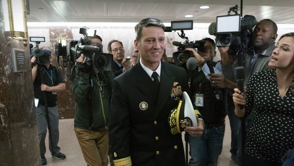 Rear Adm. Ronny Jackson, President Donald Trump's choice to be secretary of the Department of Veterans Affairs, leaves a Senate office building after meeting individually with some members of the committee that would vet him for the post, on Capitol Hill in Washington, Tuesday, 24 April 2018 - Sputnik International
