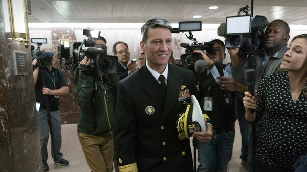 Rear Adm. Ronny Jackson, President Donald Trump's choice to be secretary of the Department of Veterans Affairs, leaves a Senate office building after meeting individually with some members of the committee that would vet him for the post, on Capitol Hill in Washington, Tuesday, April 24, 2018 - Sputnik International