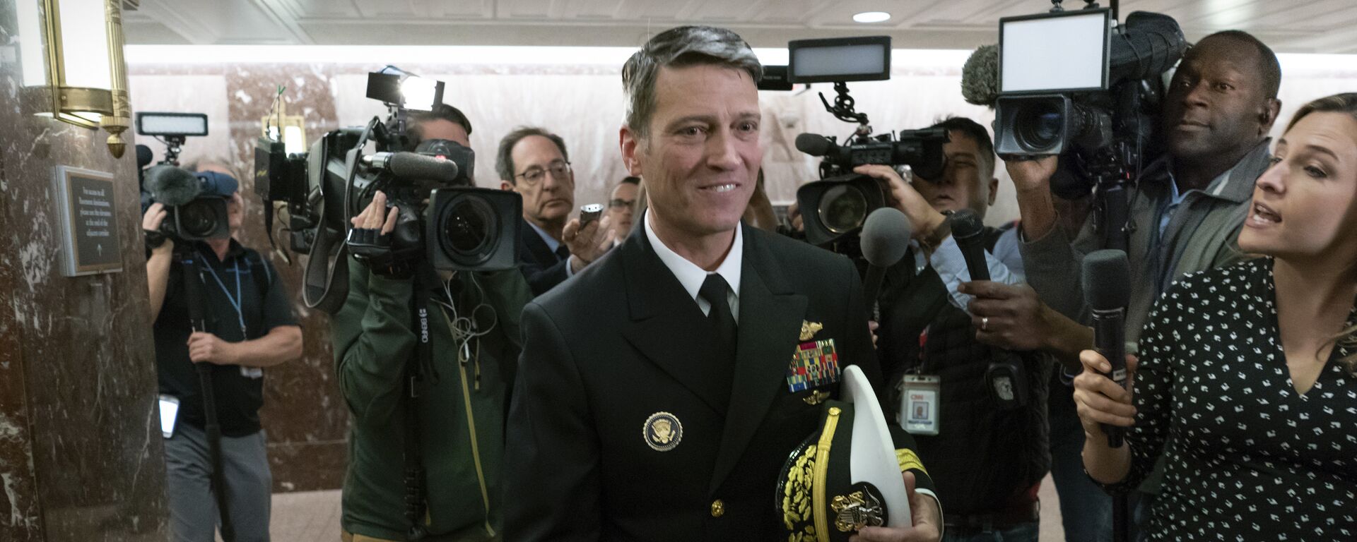 Rear Adm. Ronny Jackson, President Donald Trump's choice to be secretary of the Department of Veterans Affairs, leaves a Senate office building after meeting individually with some members of the committee that would vet him for the post, on Capitol Hill in Washington, Tuesday, April 24, 2018 - Sputnik International, 1920, 05.06.2023
