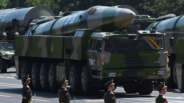 Military vehicles carrying DF-26 ballistic missiles participate in a military parade at Tiananmen Square in Beijing on September 3, 2015, to mark the 70th anniversary of victory over Japan and the end of World War II - Sputnik International