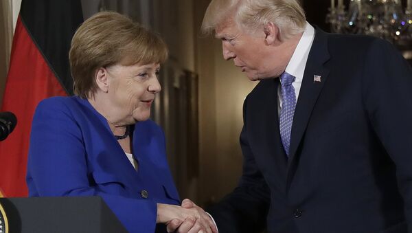President Donald Trump shakes hands with German Chancellor Angela Merkel during a news conference in the East Room of the White House, Friday, April 27, 2018, in Washington. - Sputnik International