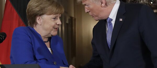 President Donald Trump shakes hands with German Chancellor Angela Merkel during a news conference in the East Room of the White House, Friday, April 27, 2018, in Washington. President Donald Trump shakes hands with German Chancellor Angela Merkel during a news conference in the East Room of the White House, Friday, April 27, 2018, in Washington. - Sputnik International