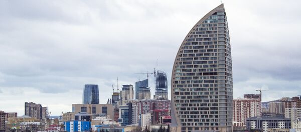 In this Feb. 19, 2016, file photo, The Trump International Hotel, the highest building, is seen in Baku, Azerbaijan - Sputnik International