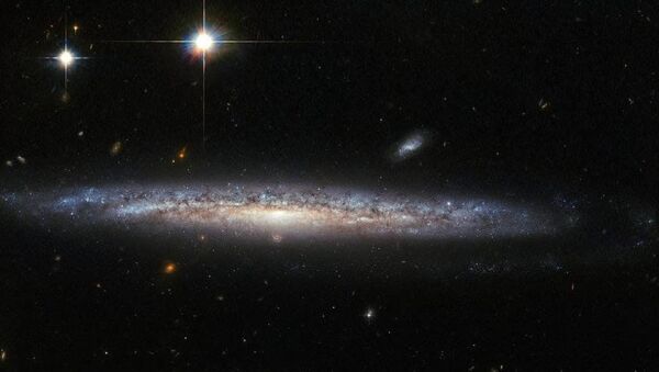 This image, captured by the Advanced Camera for Surveys (ACS) on the NASA/ESA Hubble Space Telescope, shows the spiral galaxy NGC 5714, about 130 million light-years away in the constellation of Boötes (the Herdsman) - Sputnik International