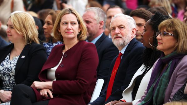 Britain's Home Secretary Amber Rudd sits next to Jeremy Corbyn, the leader of the Labour Party as they attend the unveiling of the statue of suffragist Millicent Fawcett on Parliament Square, in London, Britain, April 24, 2018 - Sputnik International
