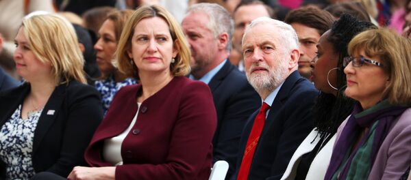Britain's Home Secretary Amber Rudd sits next to Jeremy Corbyn, the leader of the Labour Party as they attend the unveiling of the statue of suffragist Millicent Fawcett on Parliament Square, in London, Britain, April 24, 2018 Britain's Home Secretary Amber Rudd sits next to Jeremy Corbyn, the leader of the Labour Party as they attend the unveiling of the statue of suffragist Millicent Fawcett on Parliament Square, in London, Britain, April 24, 2018 - Sputnik International