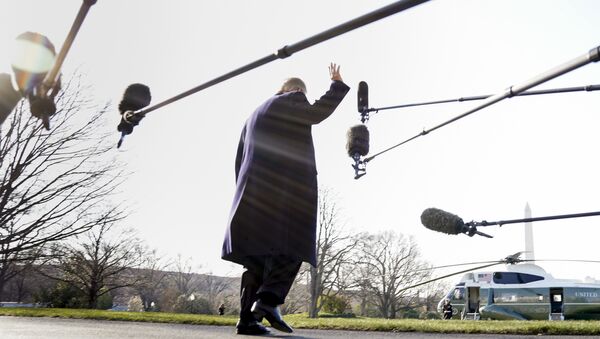 President Donald Trump waves before boarding Marine One on the South Lawn of the White House in Washington, Tuesday, March 13, 2018 - Sputnik International