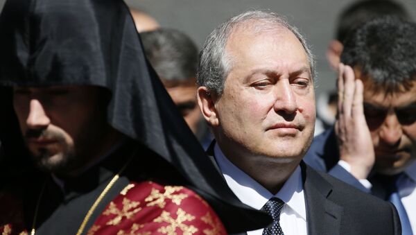 Armenian President Armen Sarkissian attends a wreath laying ceremony to commemorate the 103rd anniversary of mass killing of Armenians by Ottoman Turks, at the Tsitsernakaberd Memorial Complex in Yerevan, Armenia April 24, 2018 - Sputnik International