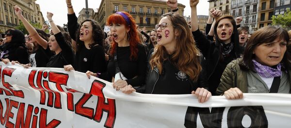 People shout slogans during a protest in Pamplona on April 28, 2018 after five men, accused of gang raping a woman at Pamplona's bull-running festival, were sentenced to nine years in jail for sexual abuse, avoiding the more serious charge of rape People shout slogans during a protest in Pamplona on April 28, 2018 after five men, accused of gang raping a woman at Pamplona's bull-running festival, were sentenced to nine years in jail for sexual abuse, avoiding the more serious charge of rape - Sputnik International