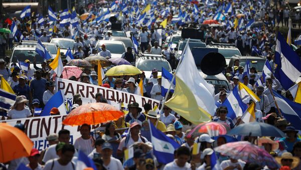 People take part in a protest march to demand an end to violence in Managua, Nicaragua, April 28, 2018 - Sputnik International