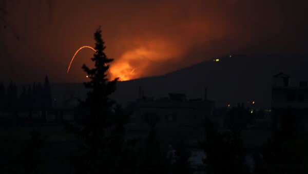 Fire and explosions are seen in what purported to be the Mountain 47 region, countryside south of Hama city, Syria, April 29, 2018 in this picture obtained from social media - Sputnik International