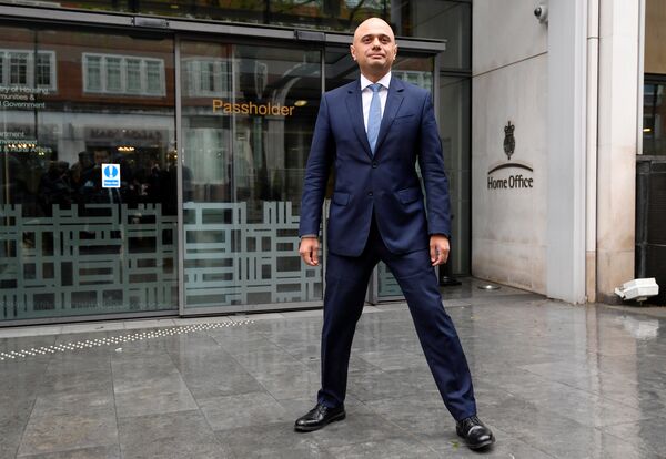 Sajid Javid stands outside the Home Office after being named as Britain's Home Secretary, in London, April 30, 2018. Sajid Javid stands outside the Home Office after being named as Britain's Home Secretary, in London, April 30, 2018. - Sputnik International