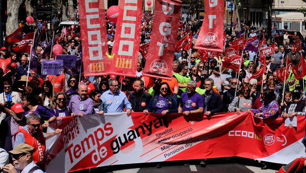 Demonstrators of Spain's leading trade unions CCOO and UGT march during May Day celebrations in Valencia - Sputnik International