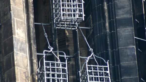 Iron baskets that held the corpses of the leaders of the Münster Rebellion at the steeple of St. Lambert's Church - Sputnik International